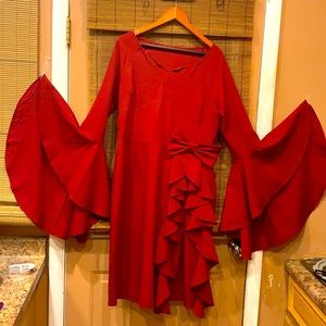 burgundy form fitting party dress. Zipper on side